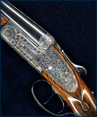 Ornately engraved double-barrel shotgun close-up