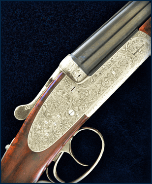 Ornately engraved double-barrel shotgun close-up