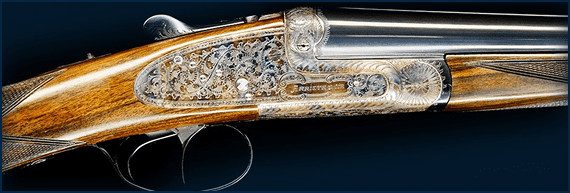 Intricately engraved double-barrel shotgun close-up